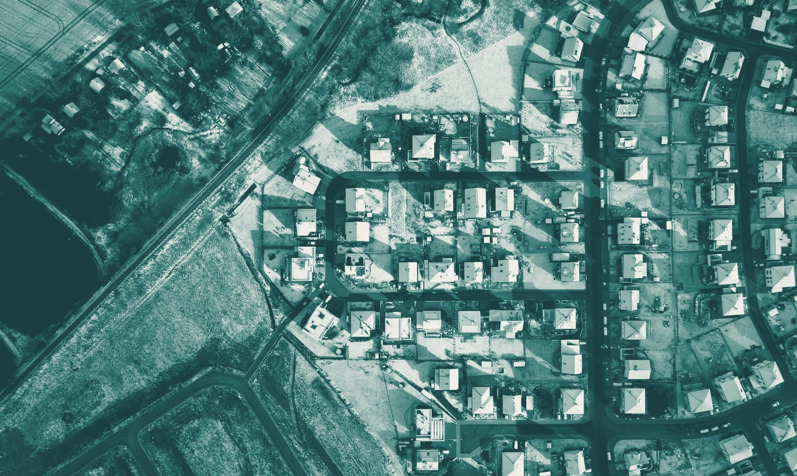 A residential neighborhood in winter from above